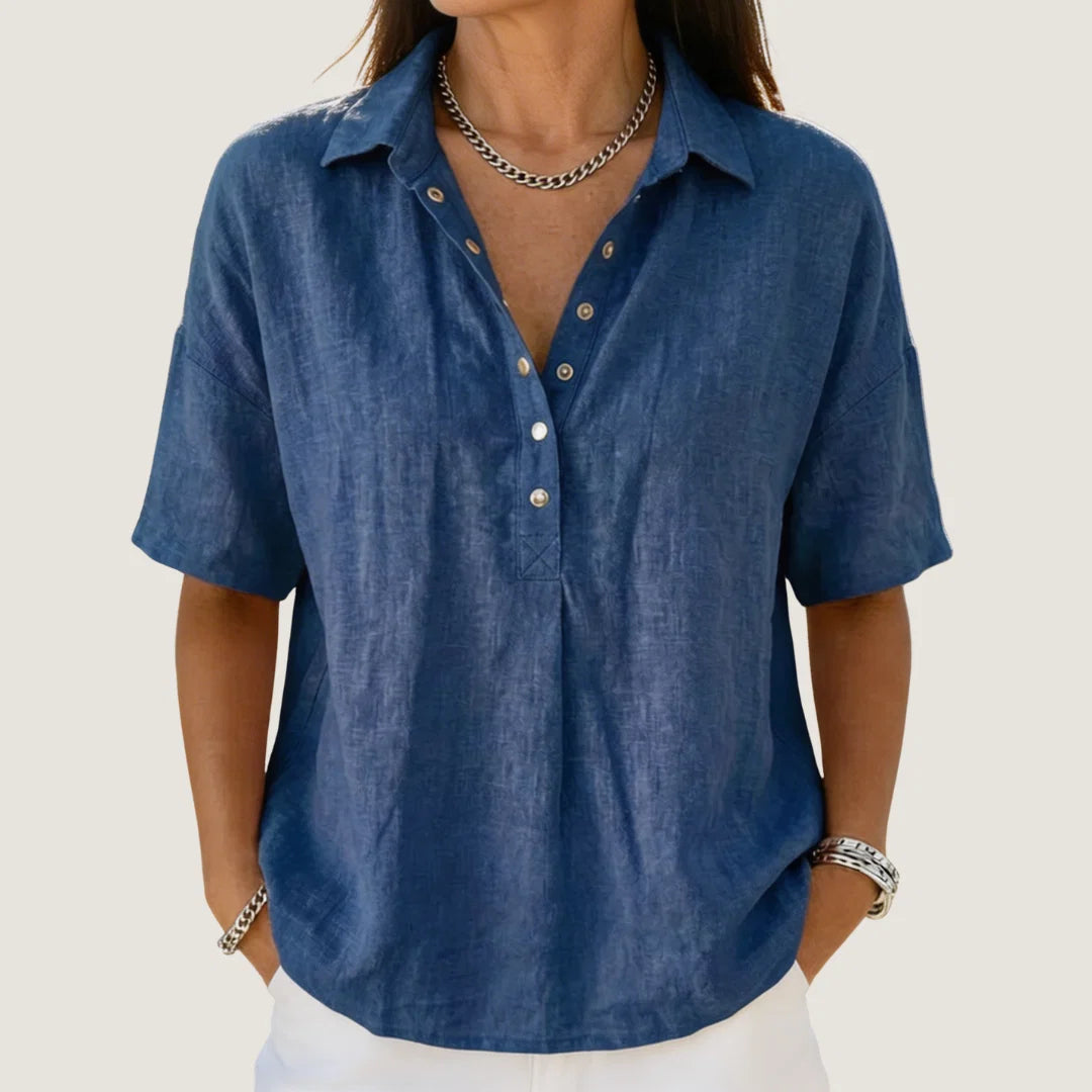 Women's relaxed collar shirt in blue with button-up front and short sleeves on model
