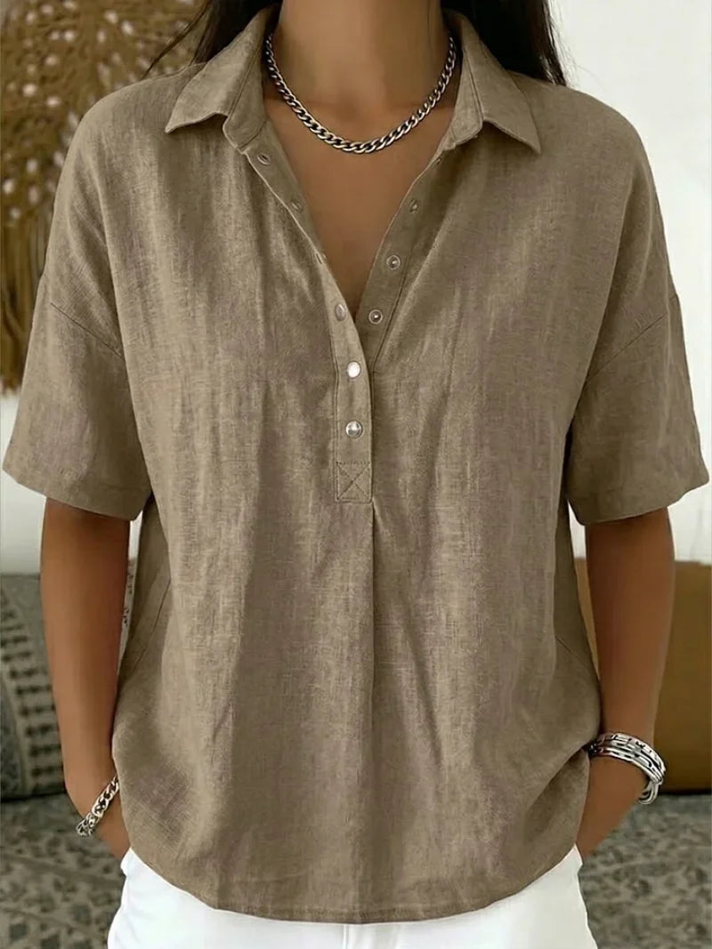 Close-up of women's relaxed collar shirt showing classic collar detail and button placket