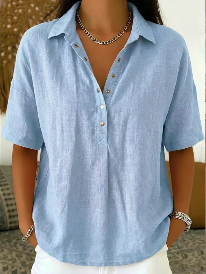 Women's relaxed collar shirt styled with white trousers for casual everyday wear