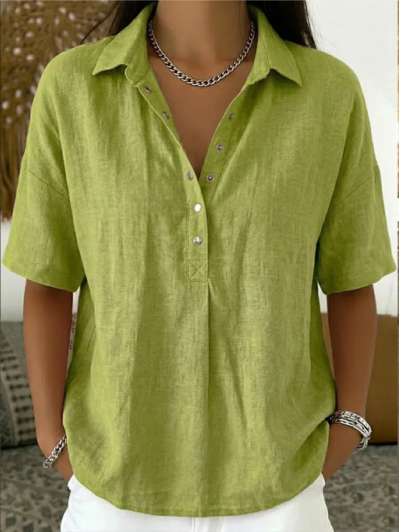 Detail shot of women's relaxed collar shirt showing button-up front and short sleeve