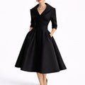 Collared midi dress with wrap bodice and A-line skirt in black, shown from the front