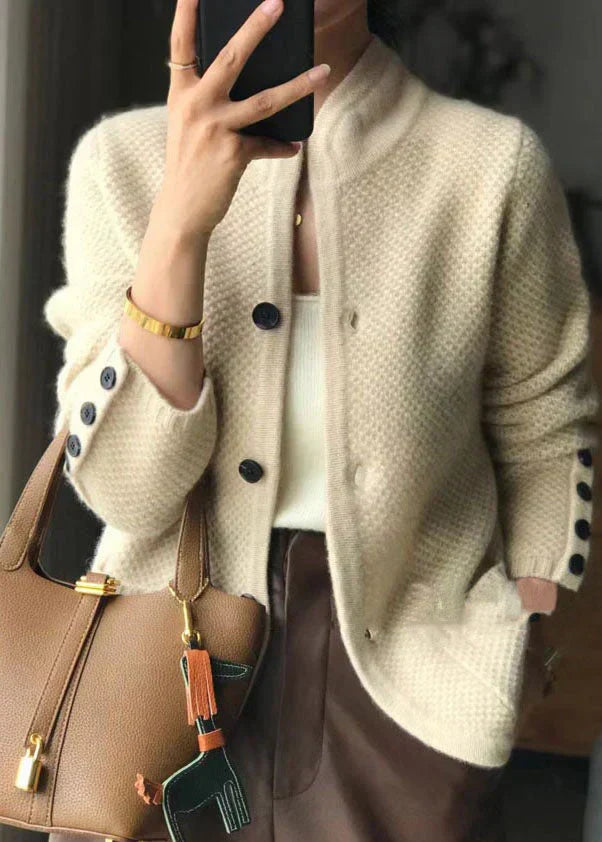 Women's button-up cardigan in cream textured knit with dark button detailing and ribbed cuffs