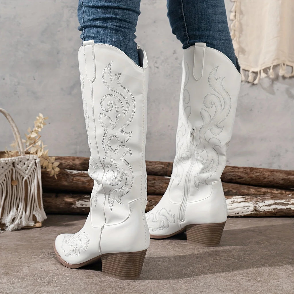 Rear view of women's knee-high cowboy boots in white with embroidered western detailing and block heel