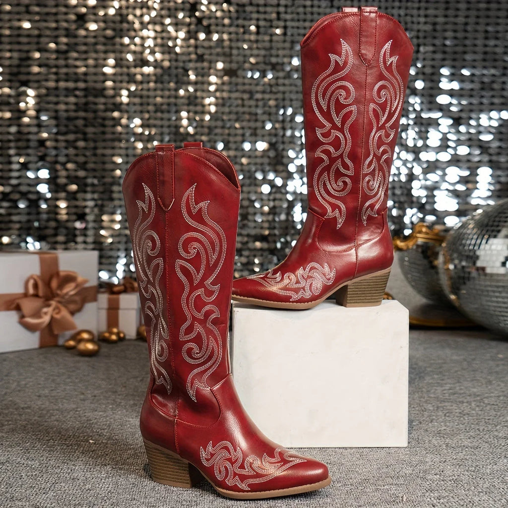 Side view of white cowboy boots with decorative embroidery and stable block heel construction