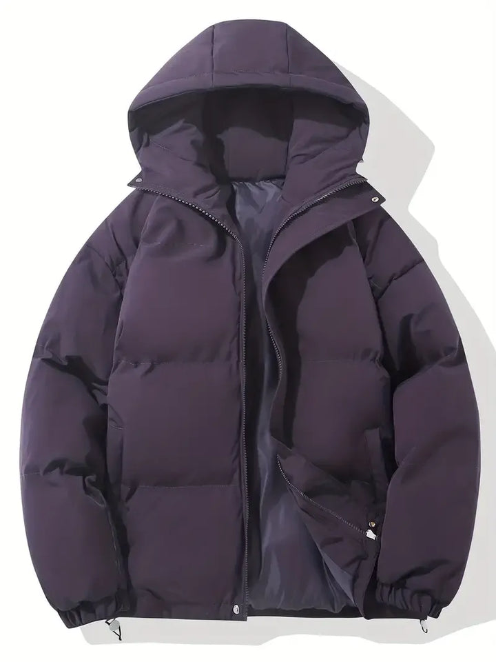 Side view of women's oversized puffer jacket with elasticated cuffs and relaxed fit silhouette