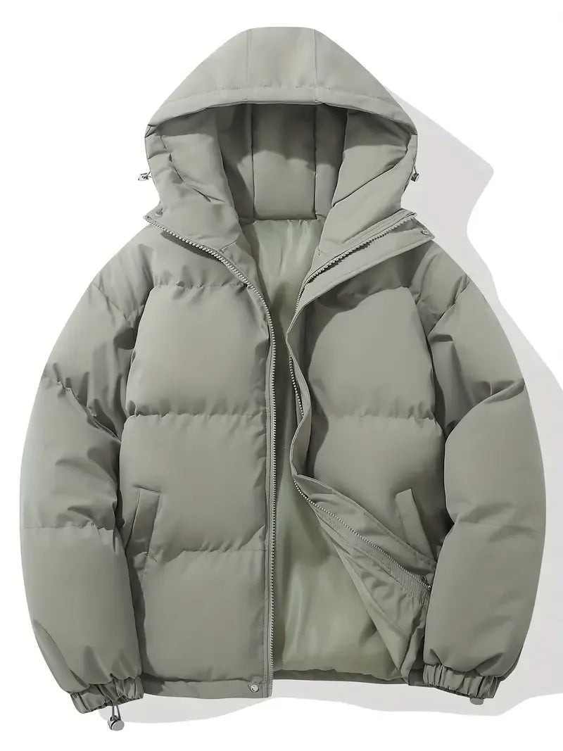 Women's black puffer jacket showing side pocket detail and oversized relaxed fit through body