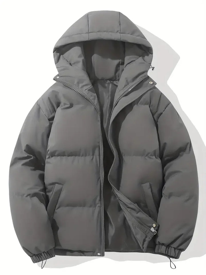 Women's puffer jacket in black featuring full-length zip closure and elasticated cuff detailing