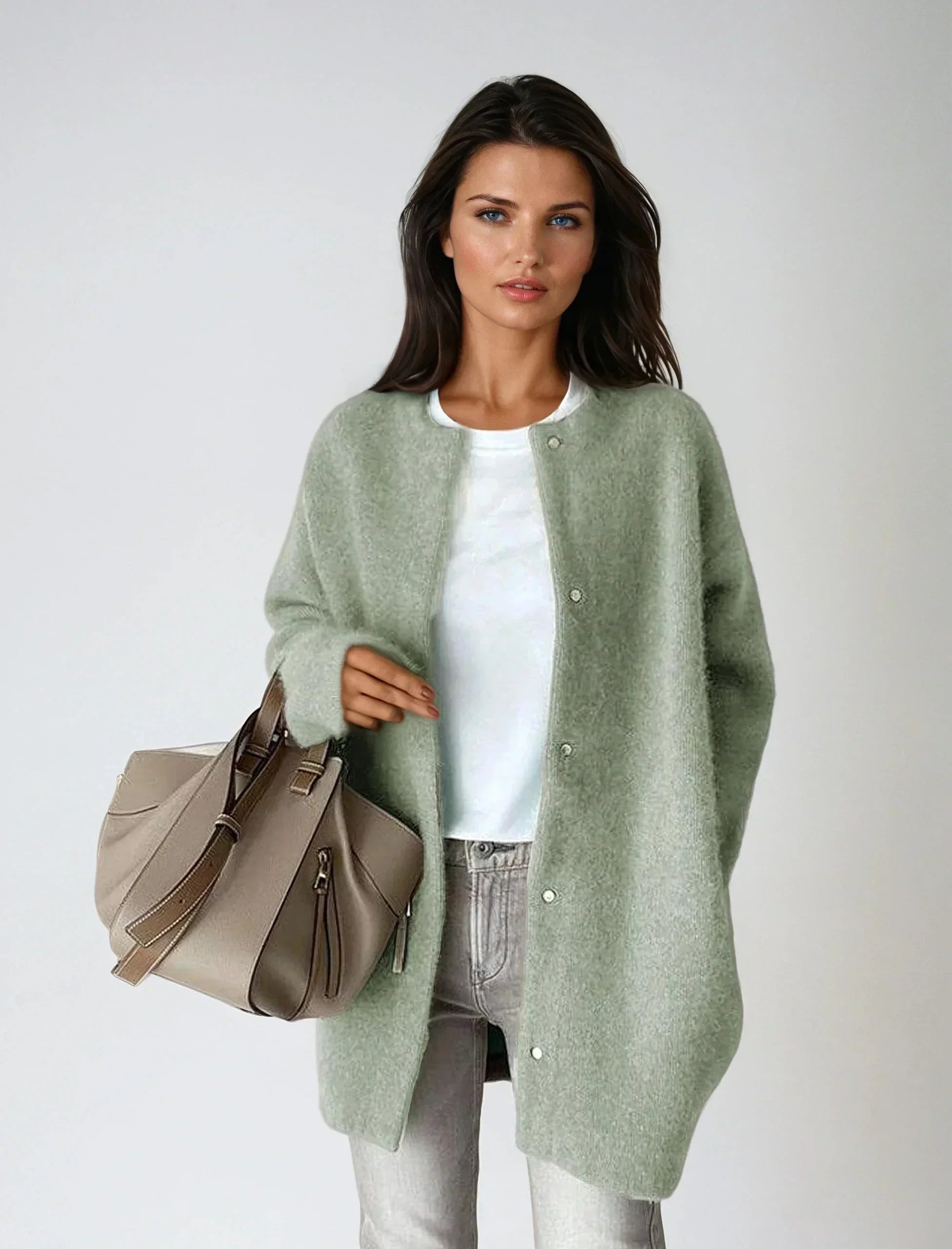 Side view of relaxed fit longline cardigan with dropped shoulders and soft drape