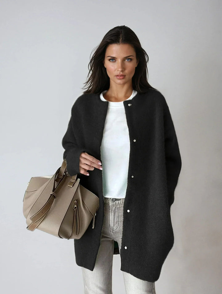 Women's beige cardigan layered over casual outfit for effortless autumn style