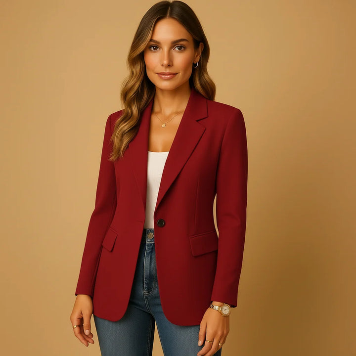 Side view of women's tailored blazer displaying long sleeves and flap pocket detailing