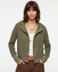 Women's waffle knit zip-up hoodie in olive green with attached hood and ribbed trim details