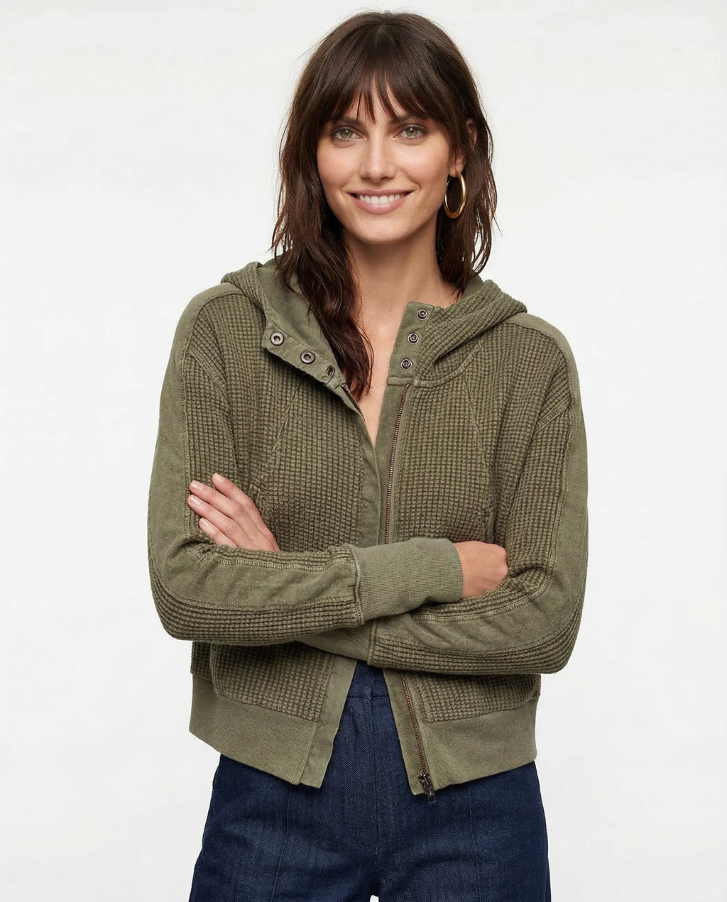 Front view of textured waffle knit hoodie with full-length zip closure and relaxed fit silhouette