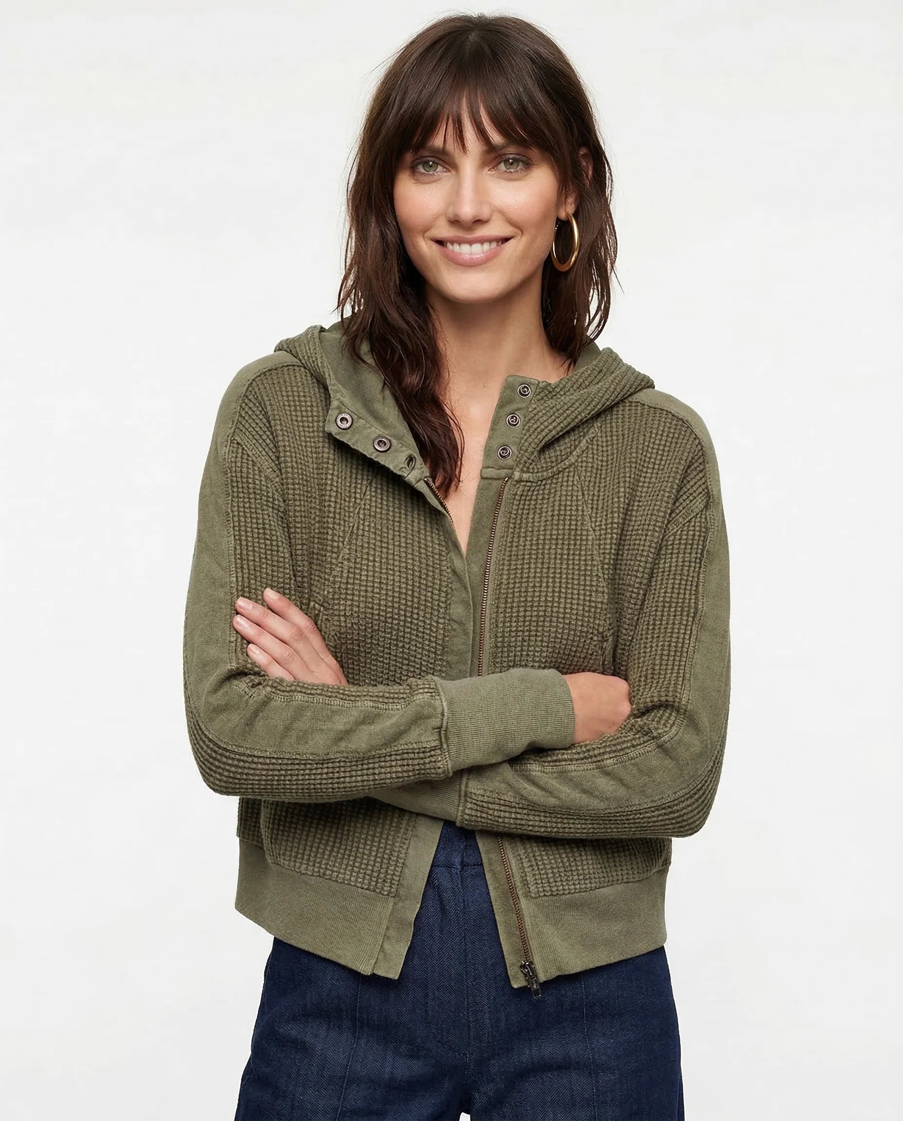 Front view of textured waffle knit hoodie with full-length zip closure and relaxed fit silhouette