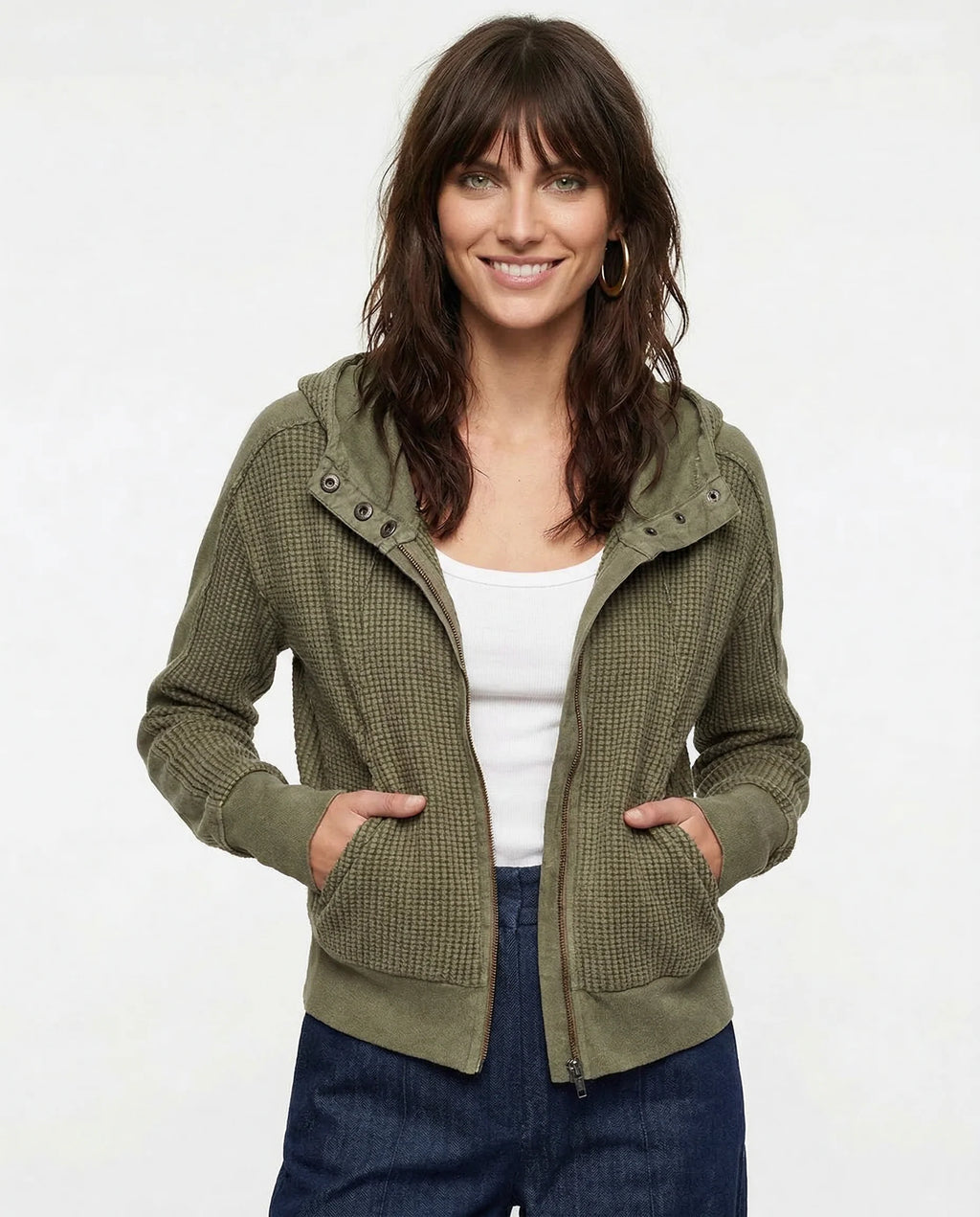 Side profile of women's zip-up hoodie featuring attached hood and casual everyday layering design