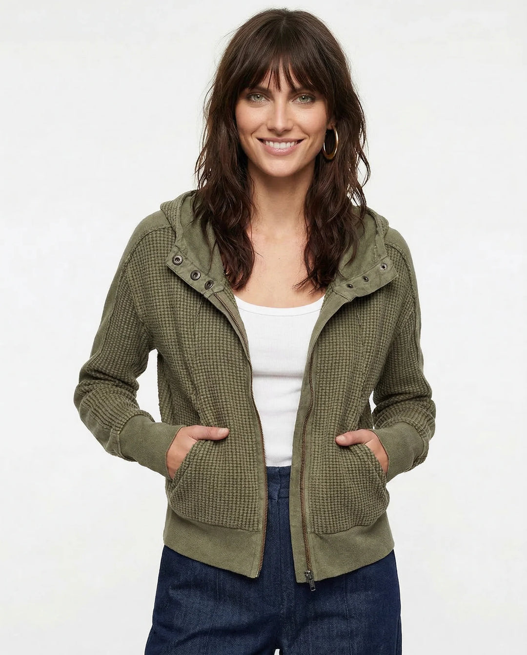 Side profile of women's zip-up hoodie featuring attached hood and casual everyday layering design