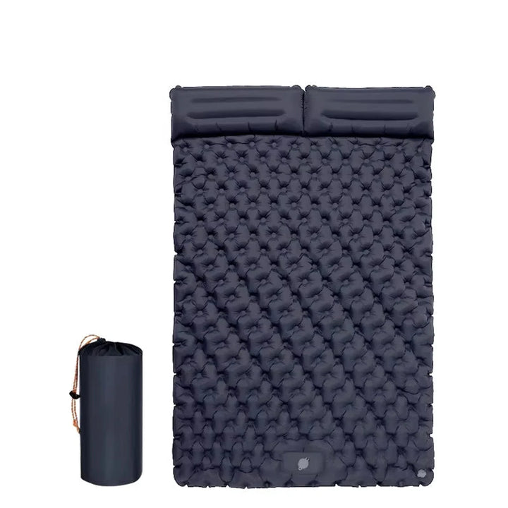 Camping mat shown partially inflated demonstrating air-cushioned texture and waterproof construction