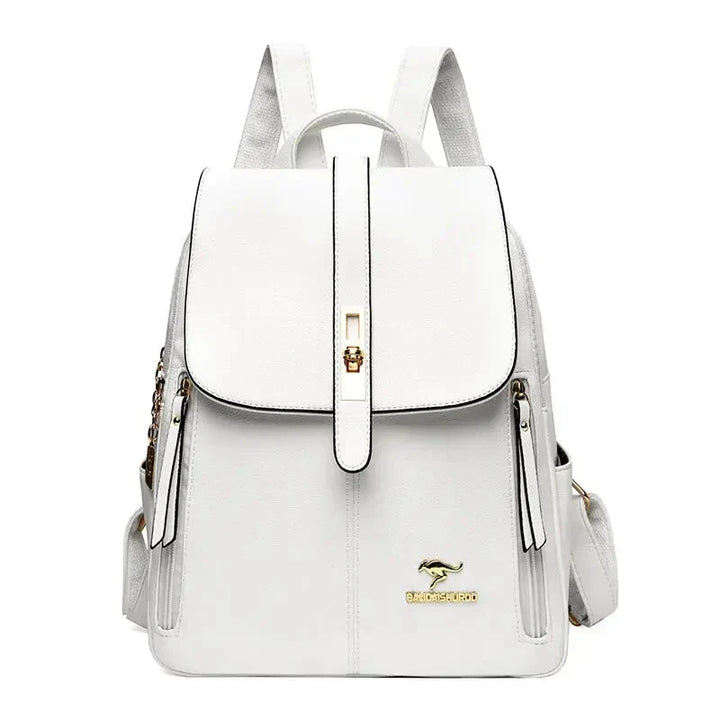 Side angle of compact men's leather backpack displaying zip compartments and top carry handle
