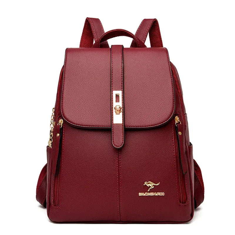 Front view of men's structured leather backpack with metal hardware and multiple storage pockets