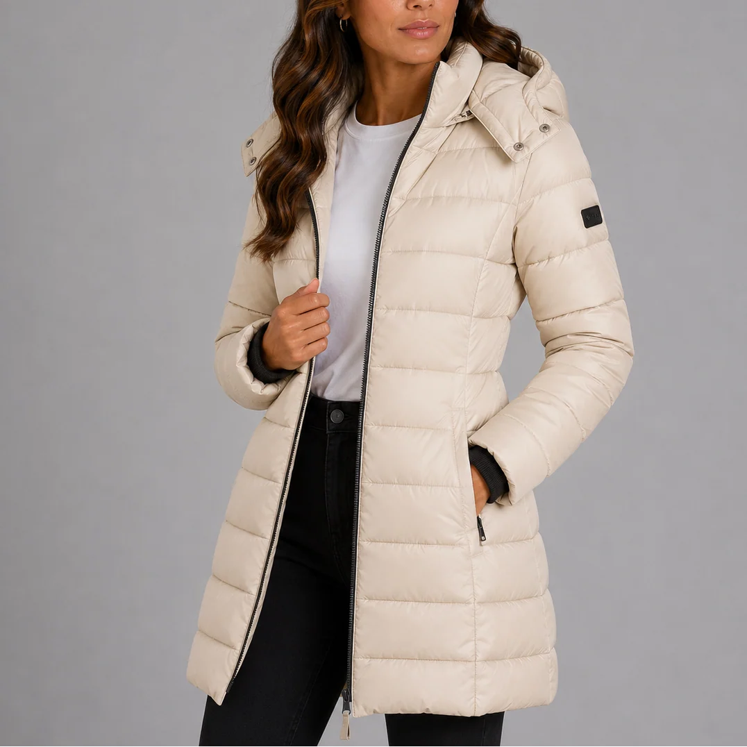 Women's hooded puffer jacket navy worn with jeans showing fitted winter coat silhouette