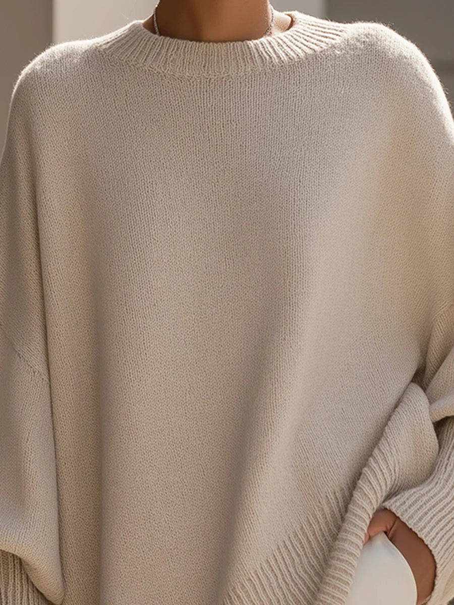 Side profile of the women's oversized jumper displaying dropped shoulder and relaxed fit