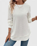Detail of ribbed cuffs on women's knit jumper with textured ribbed fabric throughout
