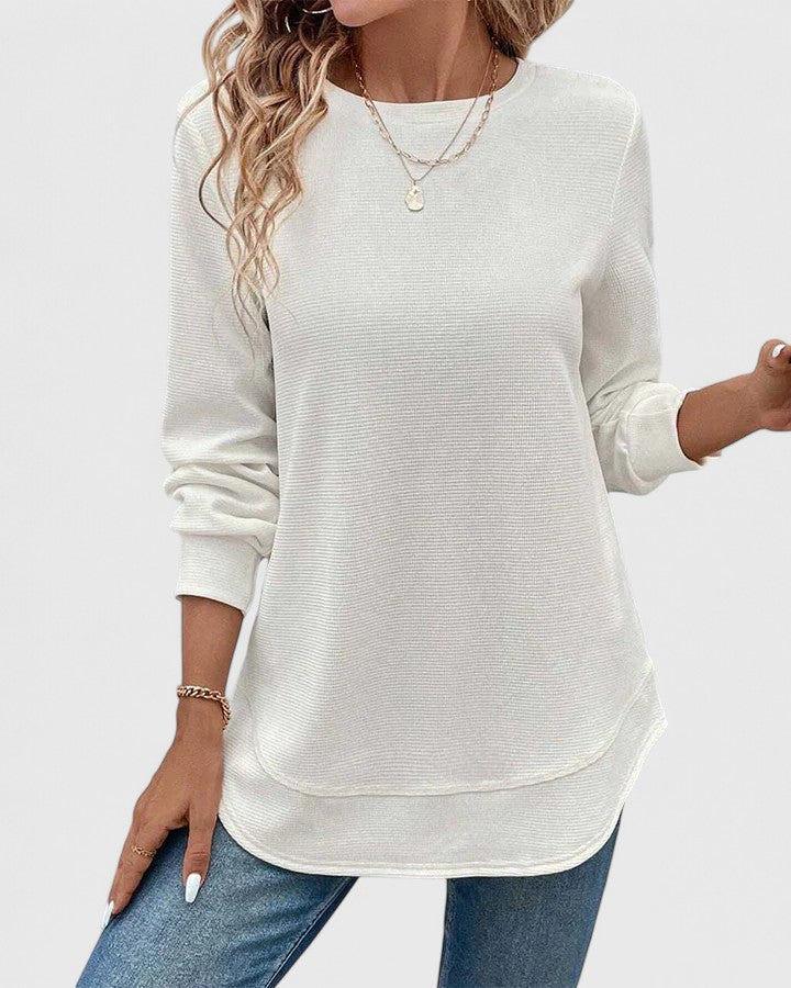 Detail of ribbed cuffs on women's knit jumper with textured ribbed fabric throughout
