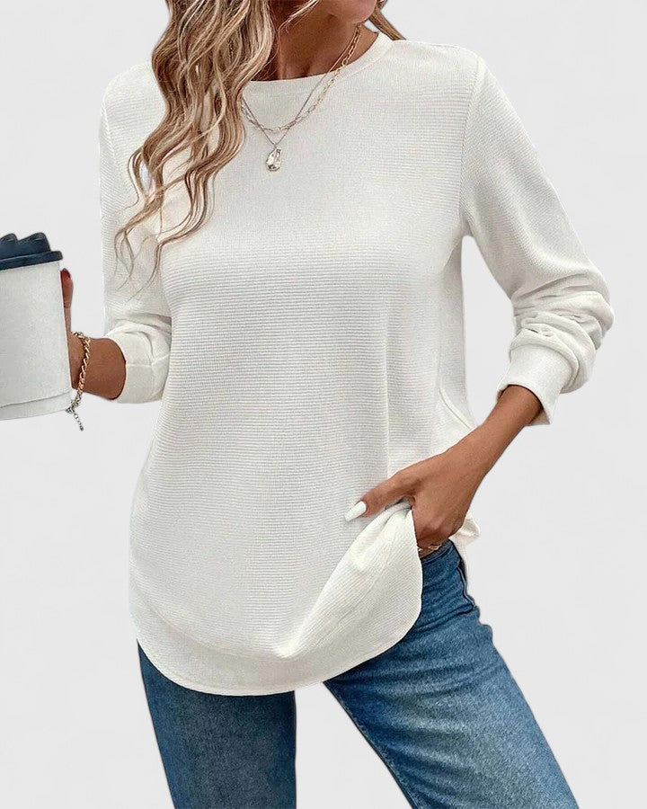 Full-length view of women's ribbed knit jumper showing crew neck, long sleeves and hip-length fit