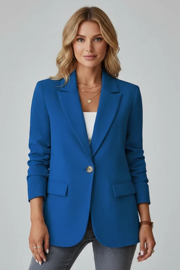 Red women's blazer with single-button closure and hip-length tailored fit
