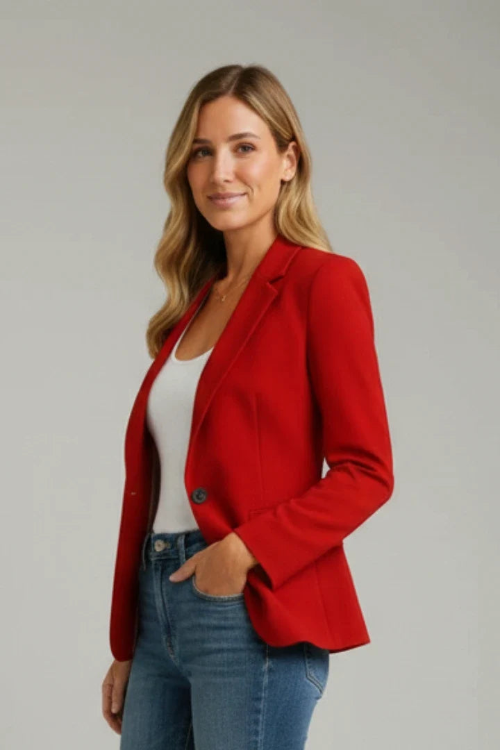 Women's tailored blazer in red showing hip-length cut and refined tailoring details