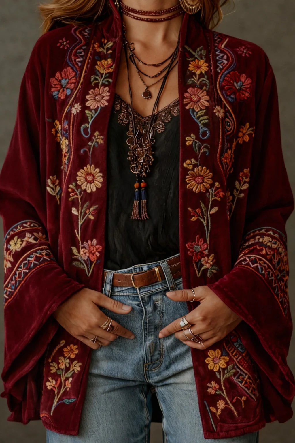 Woman wearing the velvet bohemian cardigan showcasing the graceful movement of the wide sleeves and relaxed fit