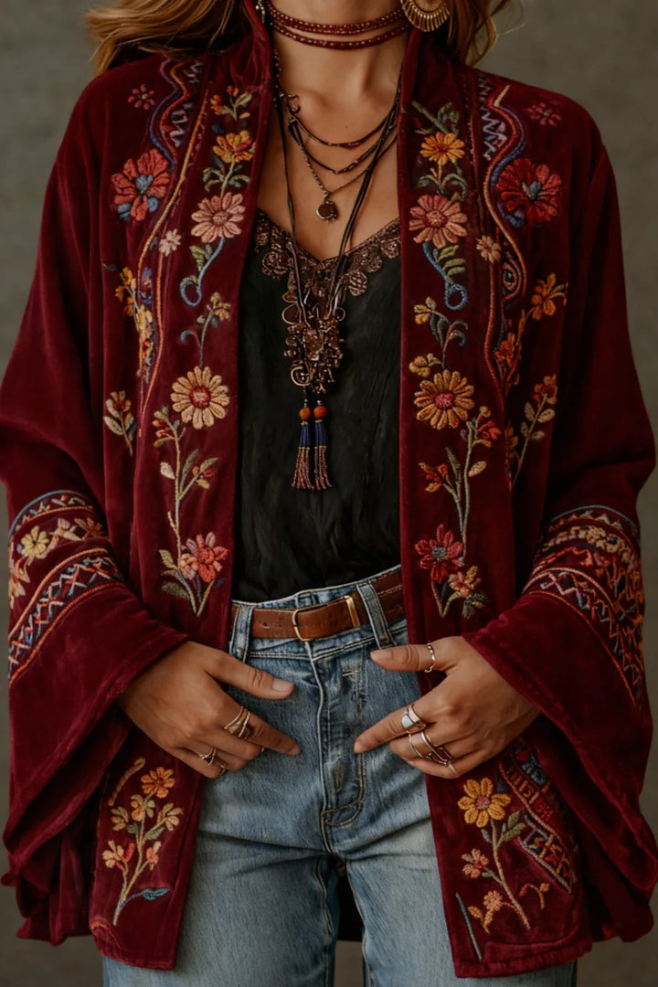 Woman wearing the velvet bohemian cardigan showcasing the graceful movement of the wide sleeves and relaxed fit