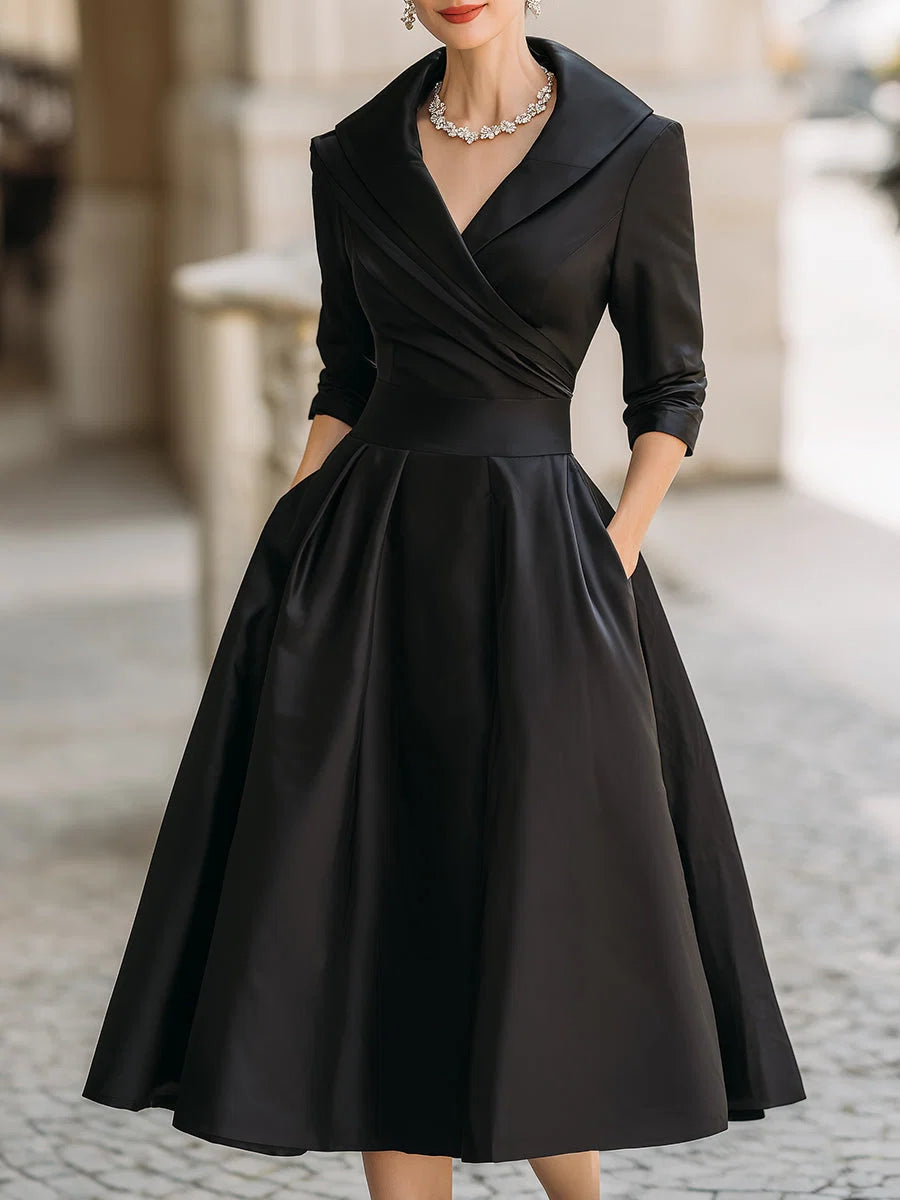 Wrap bodice midi dress with wide lapel collar and full pleated A-line skirt in black