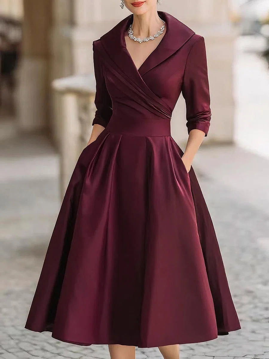 Rear view of wrap bodice midi dress showing A-line silhouette and structured drape