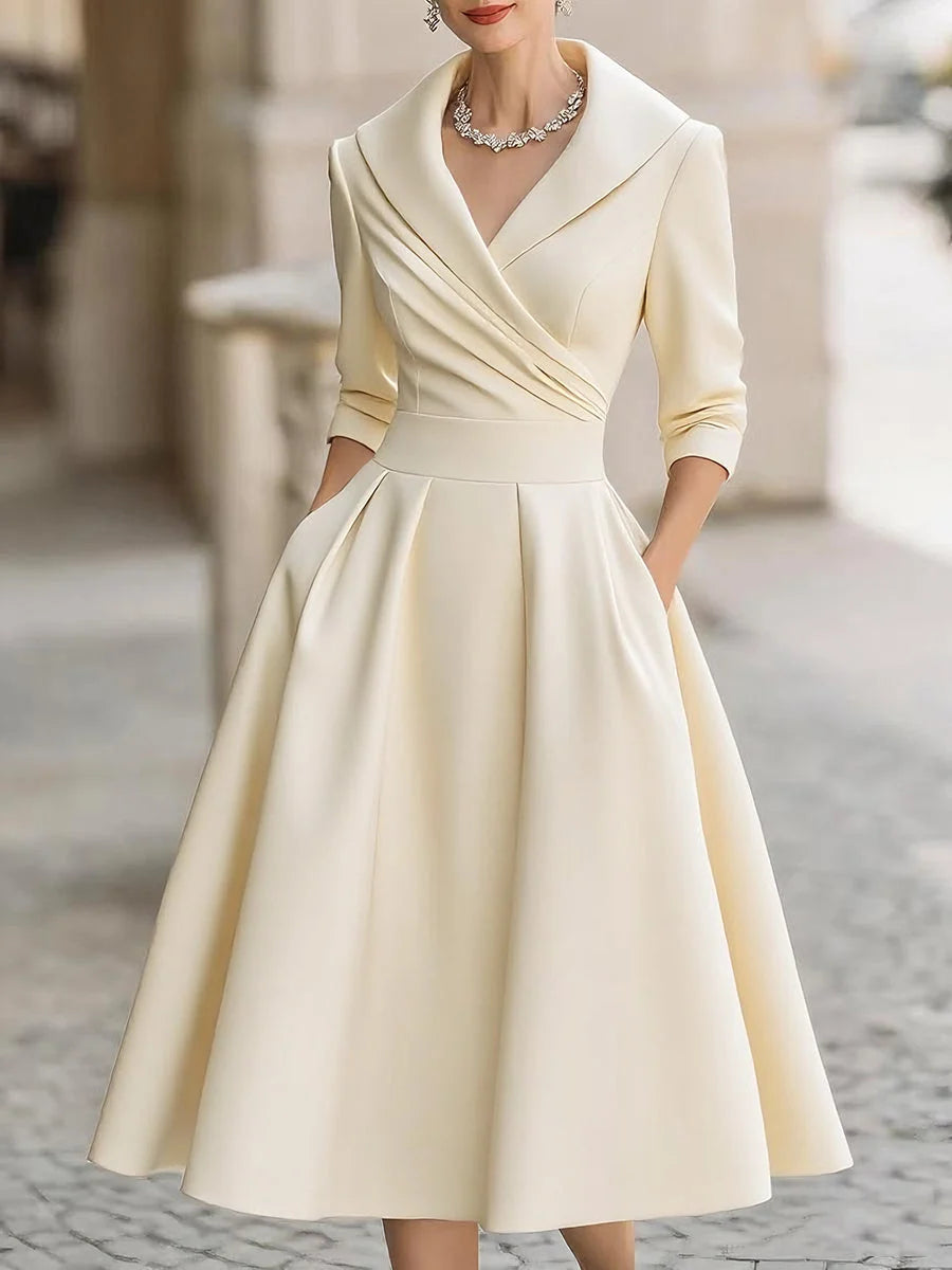 Detail of wide lapel collar and wrap bodice on midi dress