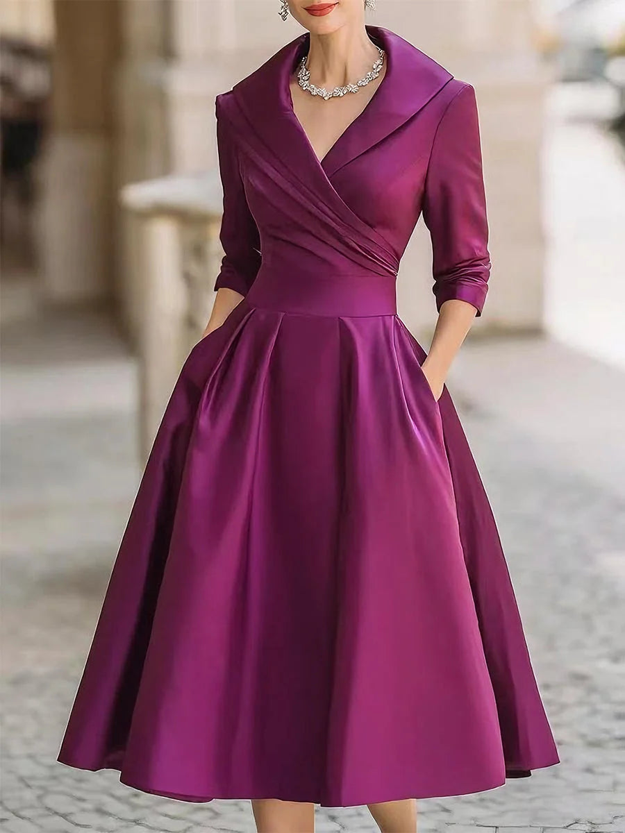 Full-length view of occasion-ready midi dress with pleated skirt falling below the knee