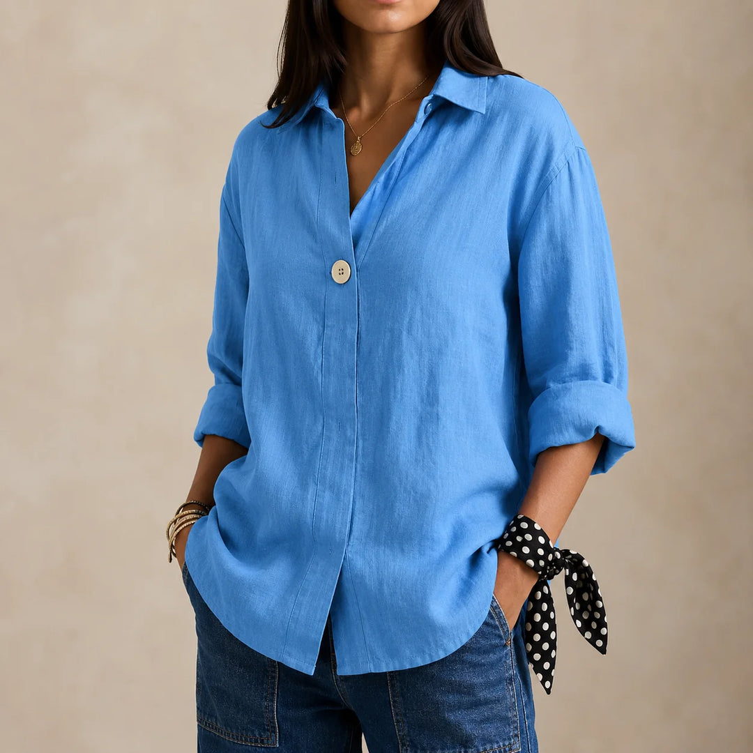 Relaxed linen blouse worn loose over trousers demonstrating versatile styling options