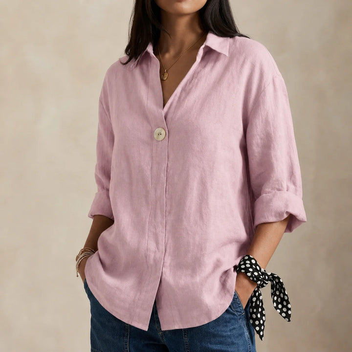 Relaxed linen blouse in neutral tone showing breathable woven fabric and casual finish