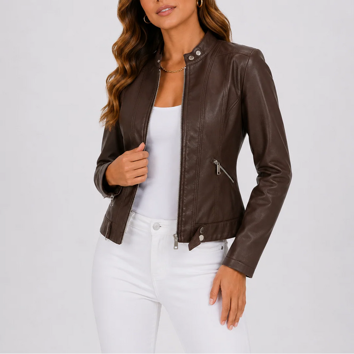 Women's biker jacket in brown with stand collar and zip front fastening worn with white jeans