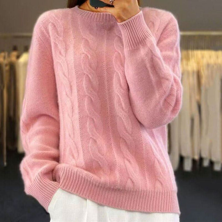 Detail of ribbed crew neckline on women's cable knit jumper