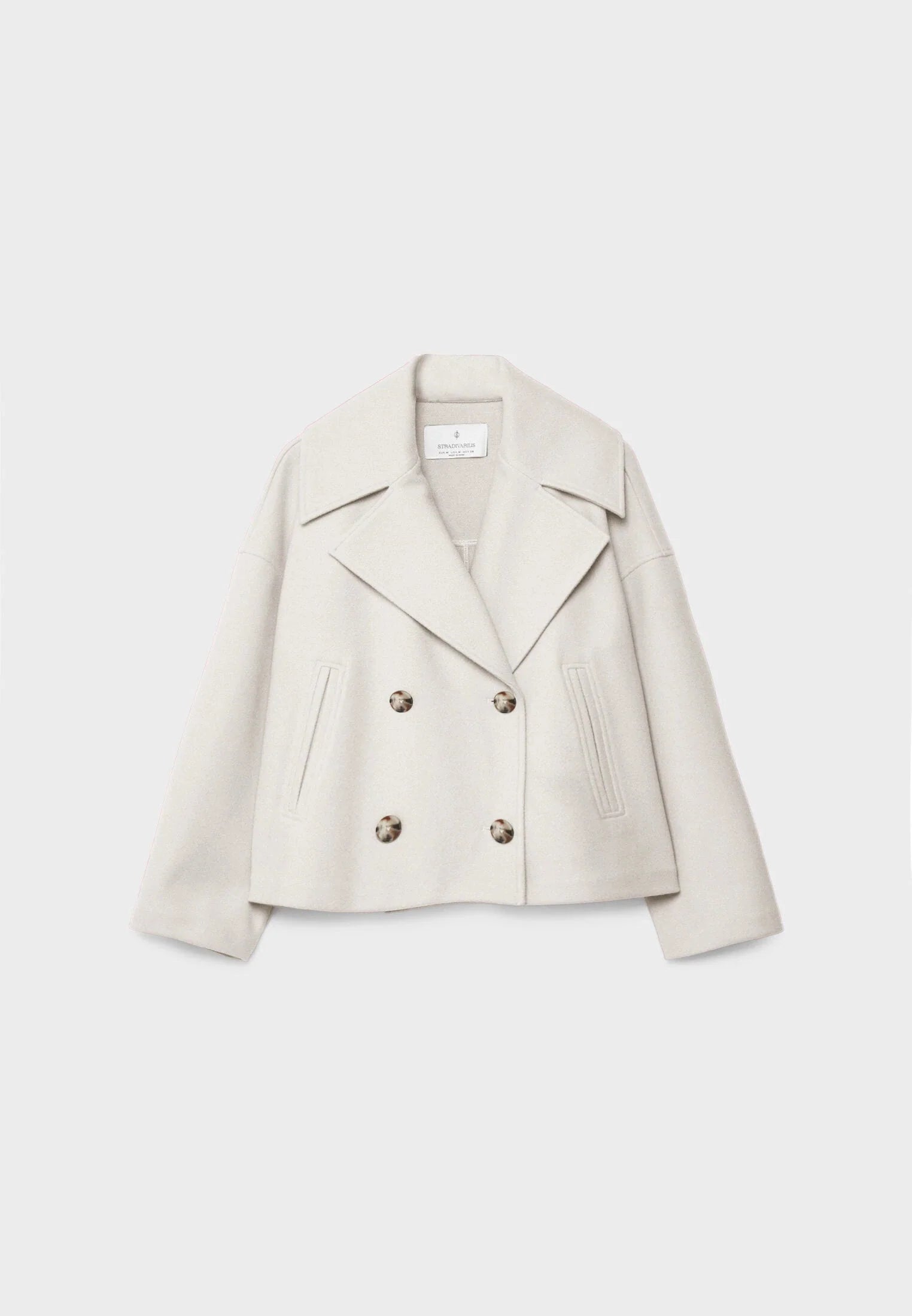 Back view of cropped blazer showing relaxed shoulder line and clean hemline