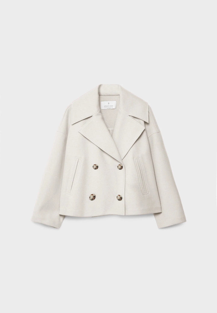 Back view of cropped blazer showing relaxed shoulder line and clean hemline