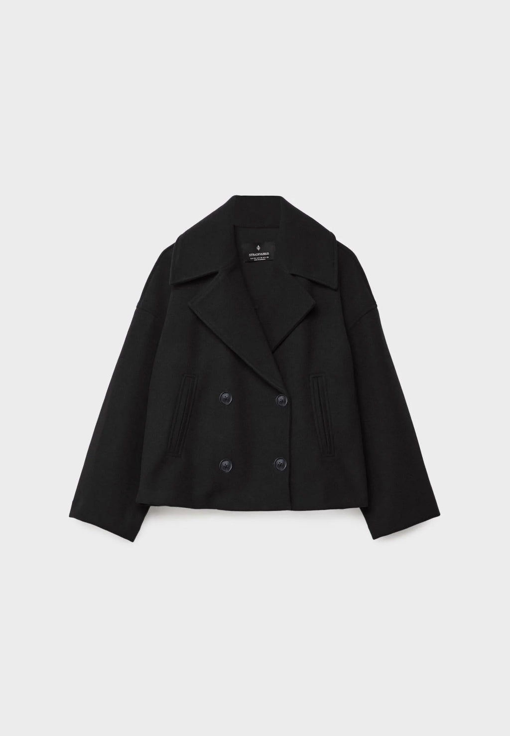 Women's double breasted blazer styled open over ribbed knitwear and casual trousers