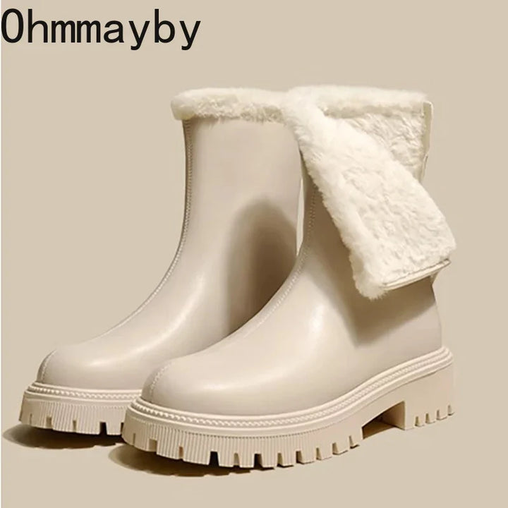 Close-up of chunky treaded sole on beige fleece ankle boots for grip and stability
