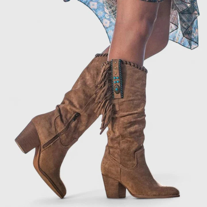 Women's fringe boots styled with floral midi skirt for bohemian autumn look