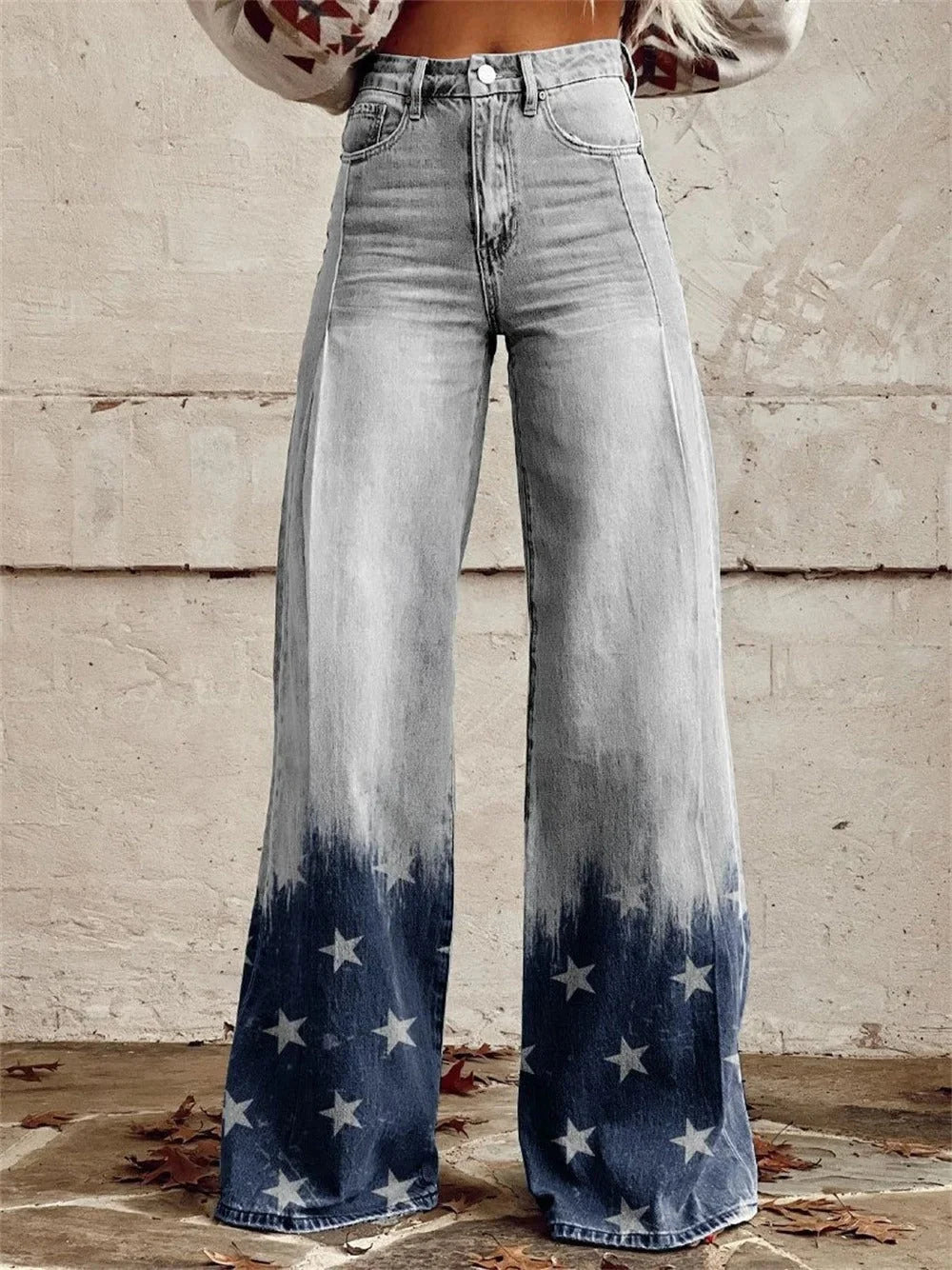 Side view of women's wide leg trousers with playful celestial dot and star pattern