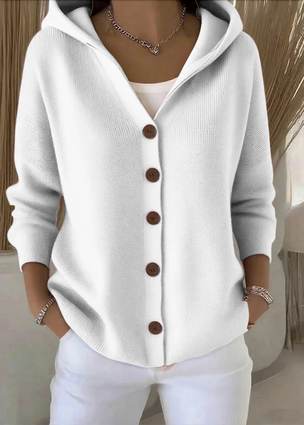 Side view of women's hooded cardigan displaying relaxed silhouette and long sleeves