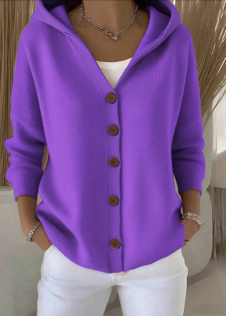 Women's hooded cardigan styled with white trousers for casual everyday look
