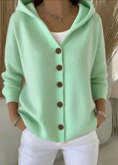 Back view of hooded cardigan showing ribbed knit texture and relaxed drape
