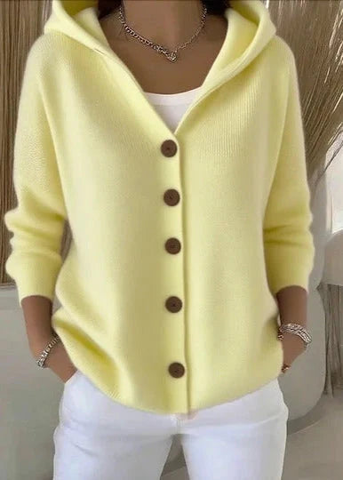 Detail of cardigan buttons and ribbed knit texture on front panel