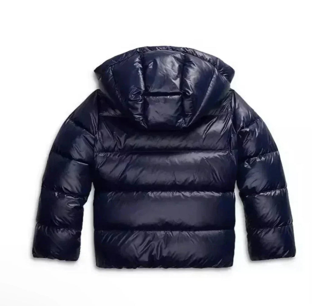 Detail shot of puffer jacket sleeve and quilted panelling with glossy finish